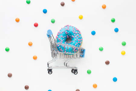 Abstract colorful donuts bakery, sweet concept background with place for text. Top view. Glazed...