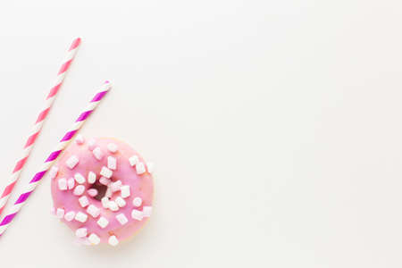 Abstract colorful donuts bakery, sweet concept background with place for text. Top view. Glazed donuts on color background.の写真素材