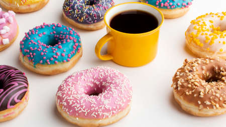 Abstract colorful donuts bakery, sweet concept background with place for text. Top view. Glazed...