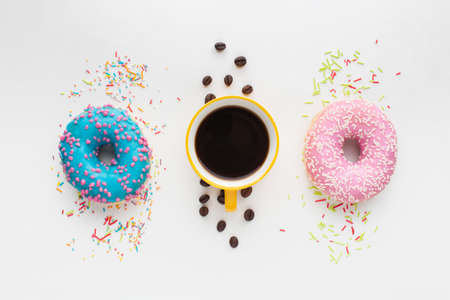 Abstract colorful donuts bakery, sweet concept background with place for text. Top view. Glazed donuts on color background.の写真素材