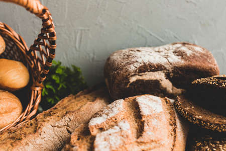 Different baking buns, croissants, gingerbread cookies. Delicious freshly baked bread on wooden...