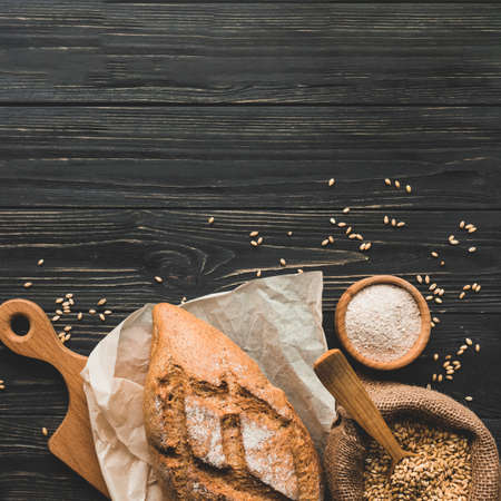 Different baking buns, croissants, gingerbread cookies. Delicious freshly baked bread on wooden...