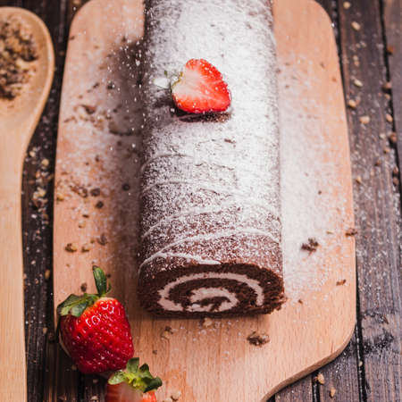 Sponge cake roll with chocolate and strawberryの写真素材