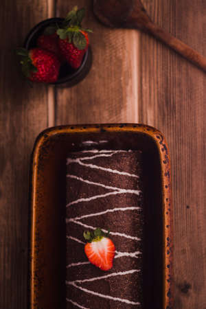 Sponge cake roll with chocolate and strawberryの写真素材