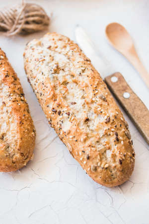 Different baking buns, croissants, gingerbread cookies. Delicious freshly baked bread on wooden...
