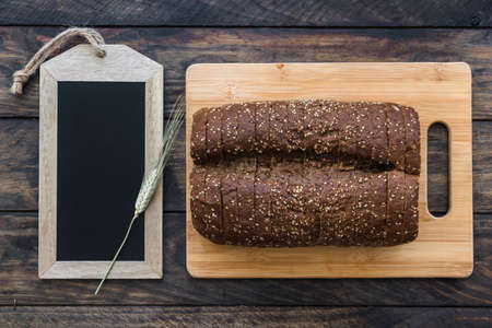 Different baking buns, croissants, gingerbread cookies. Delicious freshly baked bread on wooden...