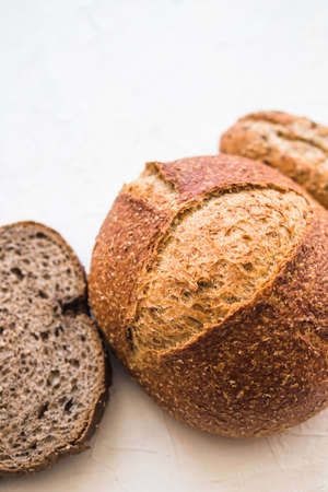 Different baking buns, croissants, gingerbread cookies. Delicious freshly baked bread on wooden...