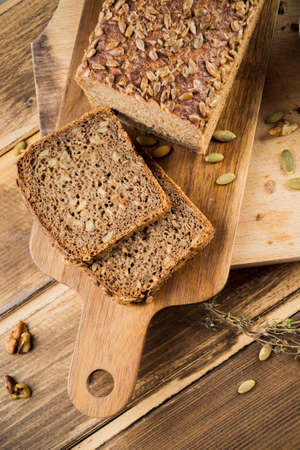 Different baking buns, croissants, gingerbread cookies. Delicious freshly baked bread on wooden...