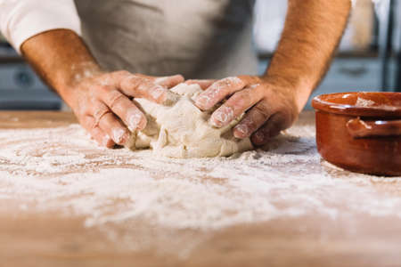 Beat flour and kitchen utensils, a baking dish, a rolling pin with eggs on the table. Baking,...