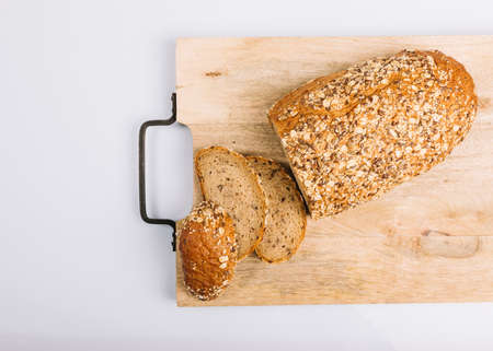 Different baking buns, croissants, gingerbread cookies. Delicious freshly baked bread on wooden...