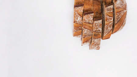 Different baking buns, croissants, gingerbread cookies. Delicious freshly baked bread on wooden background with place for text. Fresh loaves of bread And sliced ââbreads containing sesame seeds.の写真素材