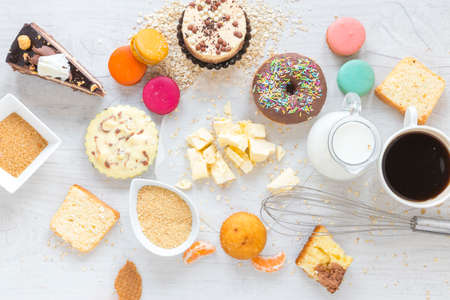 Flour and kitchen utensils whisk, baking dish, rolling pin with eggs on the table. Baking, cooking concept, top view with place for text.の写真素材