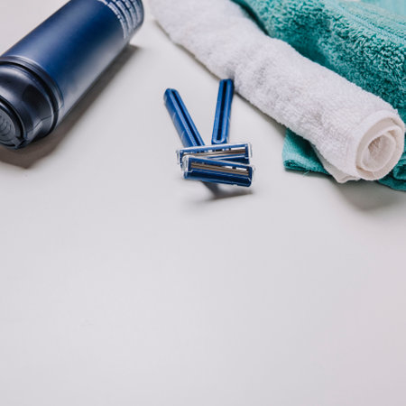 Shaver and shaving foam and towel. Shave concept background with place for text.の写真素材