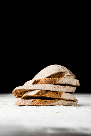 Different baking buns, croissants, gingerbread cookies. Delicious freshly baked bread on wooden...