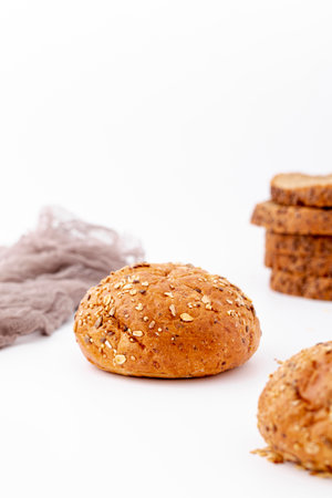 Different baking buns, croissants, gingerbread cookies. Delicious freshly baked bread on wooden...