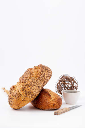 Different baking buns, croissants, gingerbread cookies. Delicious freshly baked bread on wooden...