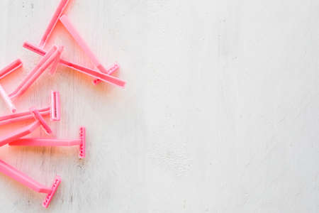 Pink disposable shaver isolated on a white background with place for text.の写真素材