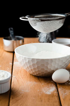 Whisk flour in a bowl, knead the doughの写真素材
