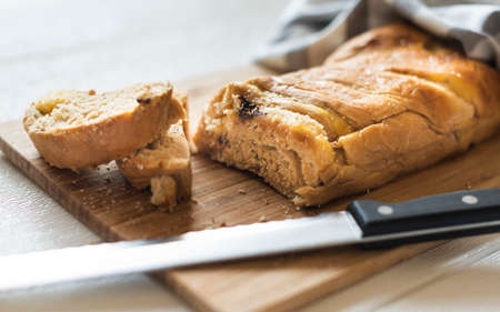 Different baking buns, croissants, gingerbread cookies. Delicious freshly baked bread on wooden...