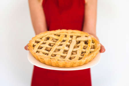 Woman hand holding cake or pieの写真素材