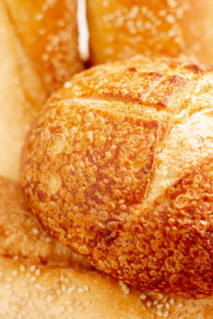Different baking buns, croissants, gingerbread cookies. Delicious freshly baked bread on wooden...