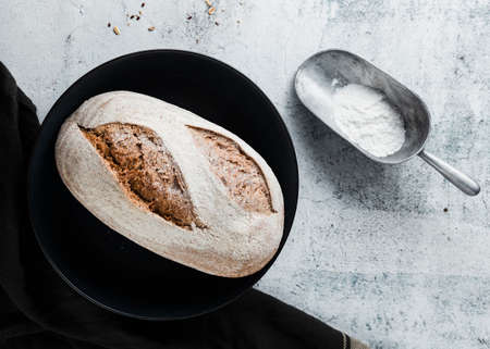 Different baking buns, croissants, gingerbread cookies. Delicious freshly baked bread on wooden...