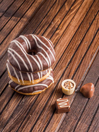 Beautiful donuts with chocolate glaze filling. Bakery sweets concept background.の写真素材