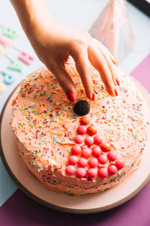 Ð¡ake with chocolate decoration on a plate. Wooden background. Copy space. Chocolate birthday cake with candles. Homemade bundt cake with icing on a gray background.の写真素材