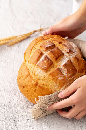 Different baking buns, croissants, gingerbread cookies. Delicious freshly baked bread on wooden...