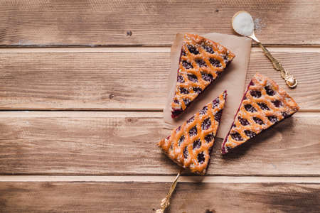 A piece of sliced apple pie. Composition with pieces of delicious pie on textured background. Piece...