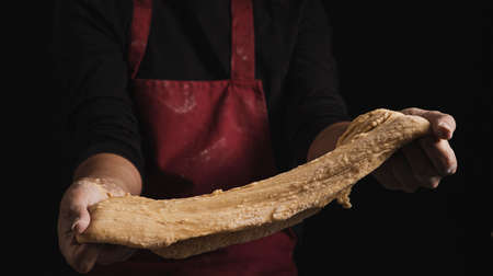 Beat flour and kitchen utensils, a baking dish, a rolling pin with eggs on the table. Baking,...