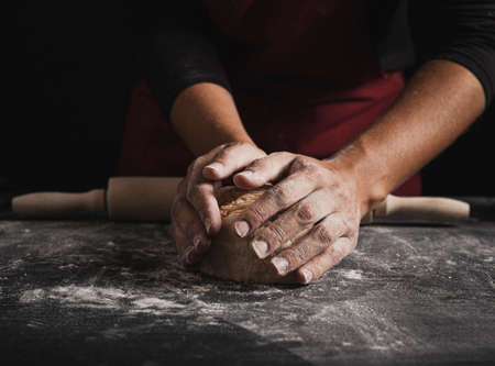 Beat flour and kitchen utensils, a baking dish, a rolling pin with eggs on the table. Baking,...