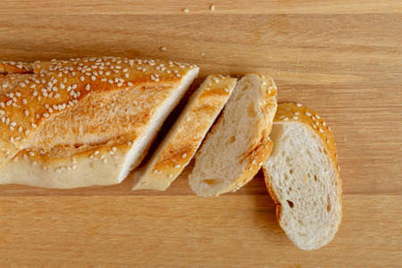 Different baking buns, croissants, gingerbread cookies. Delicious freshly baked bread on wooden...