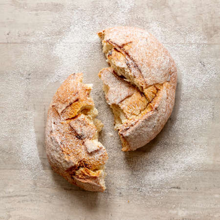 Different baking buns, croissants, gingerbread cookies. Delicious freshly baked bread on wooden...