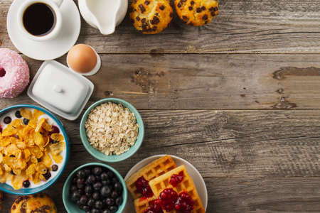 Healthy breakfast - muesli with blueberry and honey, yogurt, growing, juice and coffee. Selective...