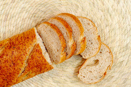 Different baking buns, croissants, gingerbread cookies. Delicious freshly baked bread on wooden...