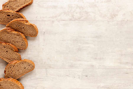Different baking buns, croissants, gingerbread cookies. Delicious freshly baked bread on wooden...
