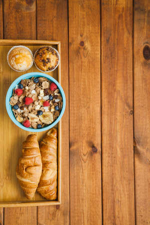 Healthy breakfast - muesli with blueberry and honey, yogurt, growing, juice and coffee. Selective...