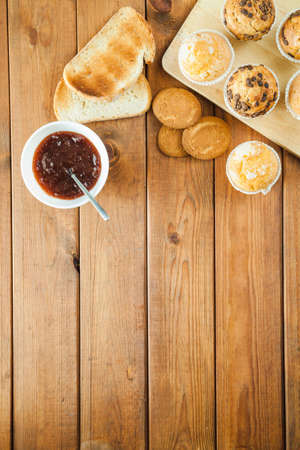 Healthy breakfast - muesli with blueberry and honey, yogurt, growing, juice and coffee. Selective focus. Top view. Flat layの写真素材
