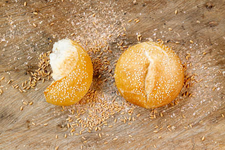 Different baking buns, croissants, gingerbread cookies. Delicious freshly baked bread on wooden...