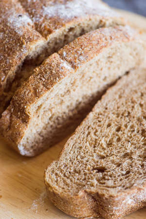 Different baking buns, croissants, gingerbread cookies. Delicious freshly baked bread on wooden...