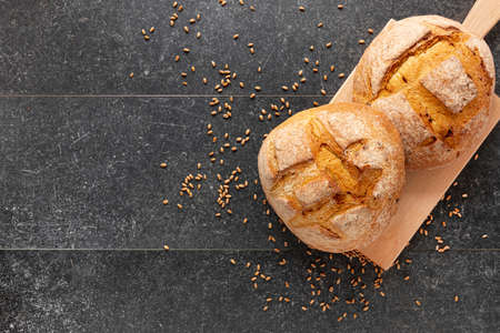 Different baking buns, croissants, gingerbread cookies. Delicious freshly baked bread on wooden...