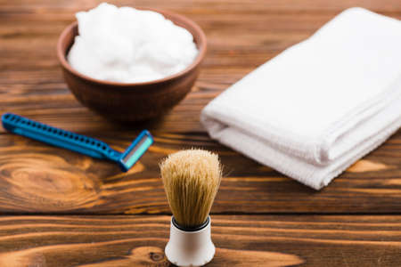 Shaving tools: brush, foam, shaver.の写真素材