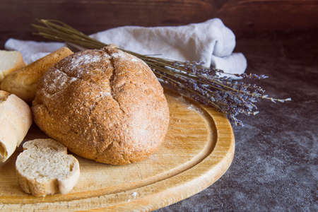 Different baking buns, croissants, gingerbread cookies. Delicious freshly baked bread on wooden...