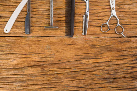 Various tools for the care of a beard and hairstyle. Scissors, razors, combs. Shaving concept....