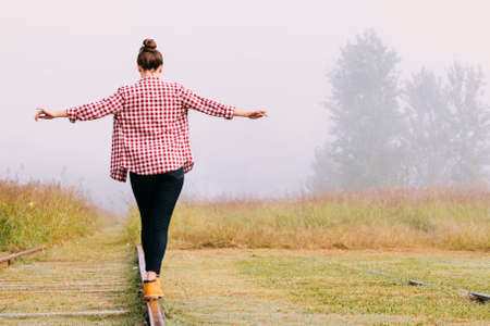 A person walking down a dirt road. High quality photoの写真素材