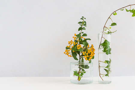 A bouquet of flowers in a vase on a table. High quality photo