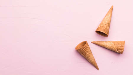 Waffle cones pink texture background on a pink background. High quality photo