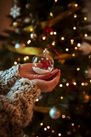 woman holding small bauble hand concept backgroudの写真素材