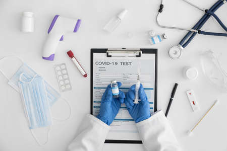 top view doctor holding covid vaccine. Resolution and high quality beautiful photo
